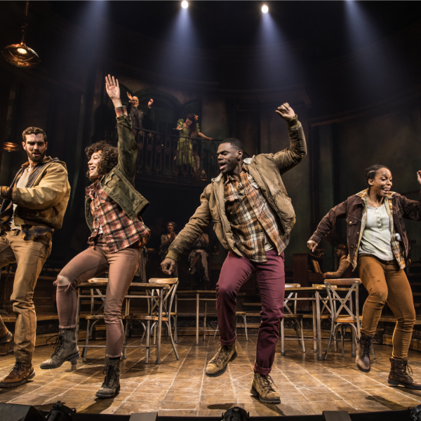 On-stage photo of Hadestown swing cast dancing